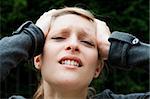 Young panic woman with hands on the head