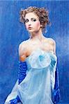 fantasy portrait of beautiful young woman imaging ice fairy on frozen blue