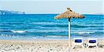 Panorama. Tropical beach with umbrella and sun loungers