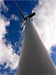 Windmill on blue cloudy sky