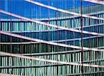 Glass facade of office building with reflection
