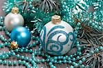 Christmas blue balls and beads decorations close-up shallow DOF