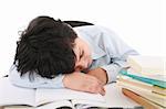 adorable boy tired to study a over white background