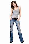 Beautiful young woman in a blue jeans. Isolated