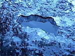 close up photo of a hole in ice