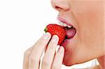 woman eat strawberry macro close up