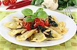 Rocket and Ricotta Cappelletti with pine nuts, tomatoes and basil