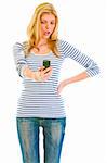 Surprised teen girl looking on mobile phone