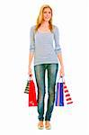 Full length portrait of teen girl with shopping bags