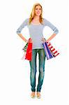 Full length portrait of smiling teen girl with shopping bags