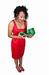 A beautiful young black woman opening a Christmas or birthday present