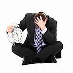 A picture of a sad businessman sitting over white background with a clock