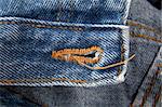 Blue jeans with buttonhole and yellow stitches