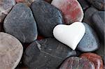 White heart heart surrounded by natural stones