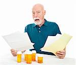 Senior man overwhelmed by the cost of his medical care and prescription drugs.  White background.