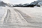 Tracks in the snow in winter time on dolomiti mountains