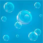 A blue illustration of some bubbles that can tiled seamlessly as a background.