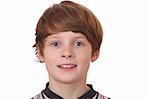 Portrait of a confident young boy on white background