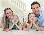 Family lying on the floor together