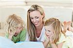 Mother reading story for her children