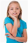 Portrait of a cute girl posing against a white background