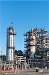 A petrochemical refinery plant with pipes and cooling towers.