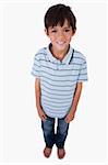 Portrait of a boy smiling at the camera against a white background