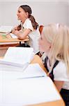 Portrait of smiling pupils during a lesson in a classroom