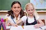 Pupils working together on an assignment in a classroom