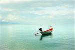 Traditional thailand boat  in the sea at sunrise