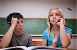 Thoughtful children working together in a classroom