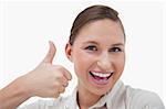 Businesswoman with the thumb up against a white background