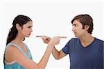 Couple mad at each other against a white background