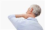 Mature man having a neck pain against a white background