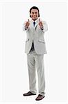 Portrait of an office worker posing with the thumbs up against a white background