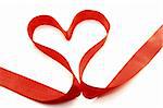 Beautiful heart from red satin ribbon on a white background