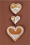 Gingerbread hearts on brown background