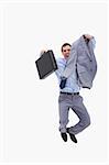 Happy businessman jumping against a white background