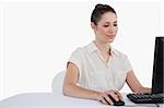Young businesswoman using a monitor against a white background