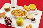 Delicious breakfast foods over red fabric background