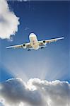 Large passenger airplane flying in the blue sky