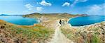 Summer rocky coastline and camping on sandy beach (Tihaja Bay (Koktebel Town in left), Crimea, Ukraine ). All peoples and cars is aunrecognizable. Five shots stitch image.