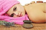 beautiful young woman in spa, stones massage