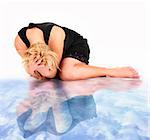 A picture of a frustrated woman and her water reflection lying over white background