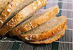 Fresh bread with bran on wooden placemat