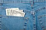 American dollars in jeans back pocket