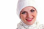 Closeup portrait of beautiful cheerful girl in winter cap over white background
