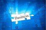 An image of a blue jigsaw puzzle with the word business