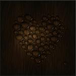 Heart shaped water drops on a wooden texture.