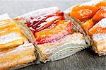 Closeup on slices of flaky fruit strudel desserts